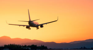 Epic landing with the sunset and the mountains, plane landing beneath a breathtaking sunset, sunset landing